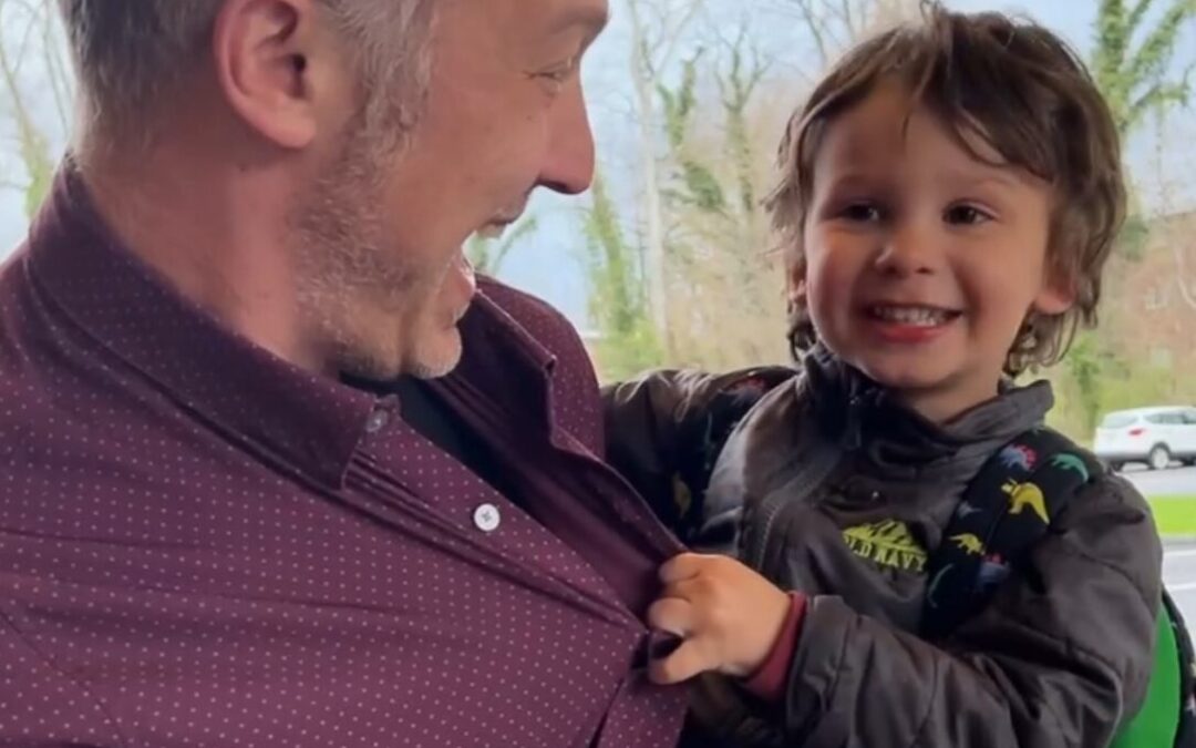 dad with child outside of school